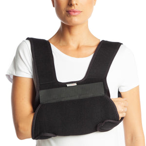 shoulde immobilizer is worn by the model without the extra belt